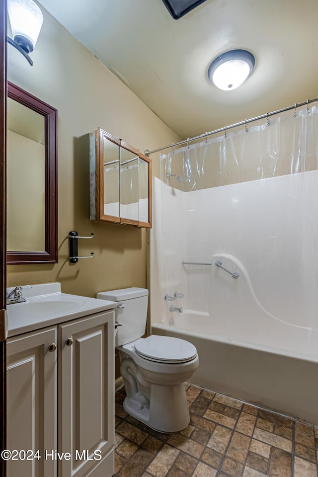 full bathroom with shower / bath combo, vanity, and toilet