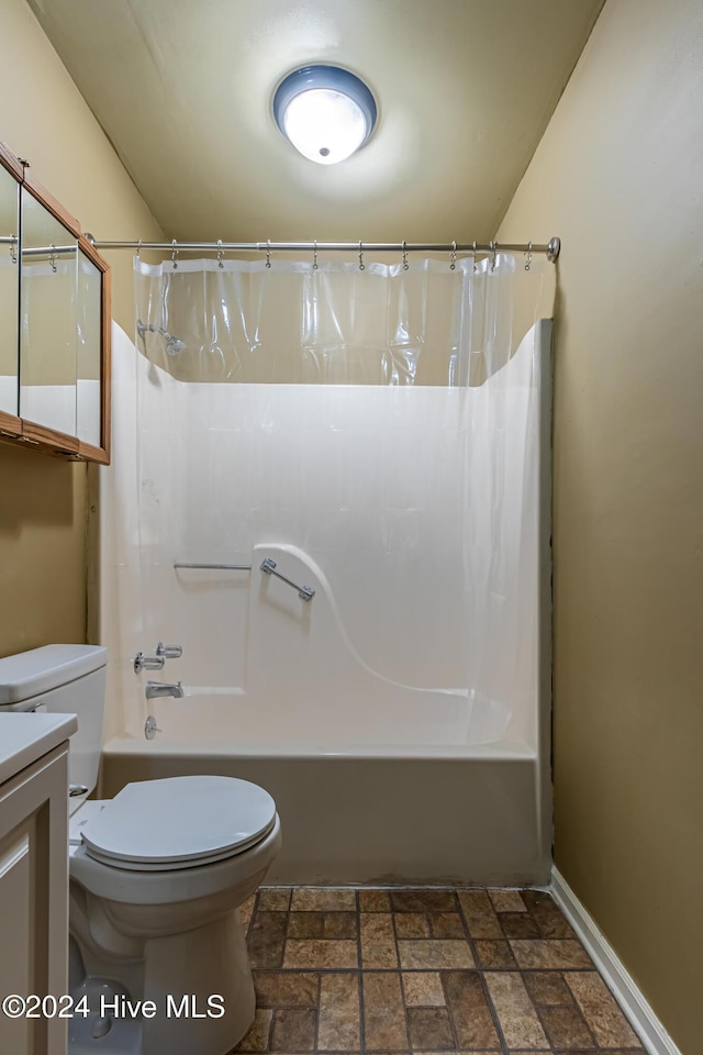 full bathroom with vanity, shower / bath combination with curtain, and toilet