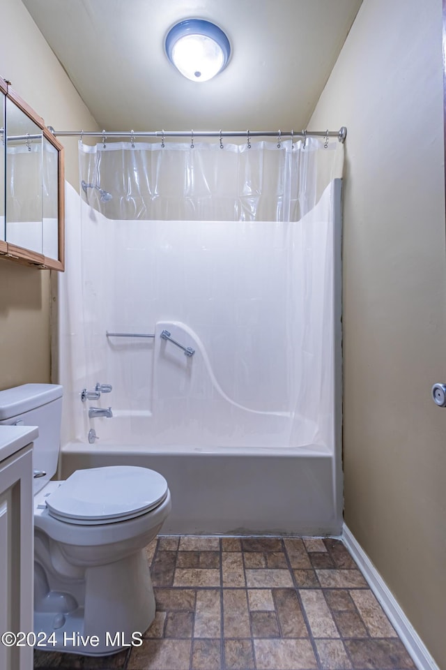 full bathroom featuring vanity, shower / bath combination with curtain, and toilet