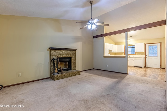 unfurnished living room with a brick fireplace, light colored carpet, vaulted ceiling, and ceiling fan