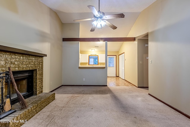 unfurnished living room with a brick fireplace, ceiling fan, light carpet, and vaulted ceiling