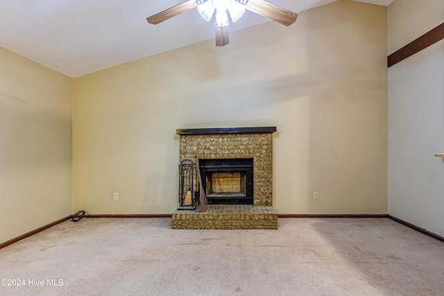 unfurnished living room featuring a fireplace, light colored carpet, ceiling fan, and lofted ceiling