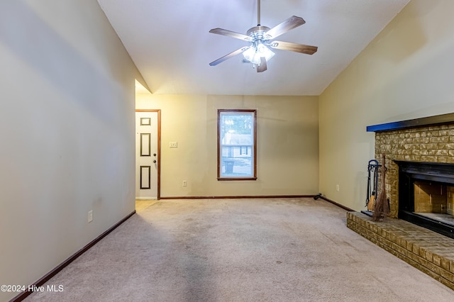 unfurnished living room featuring a fireplace, light colored carpet, and ceiling fan