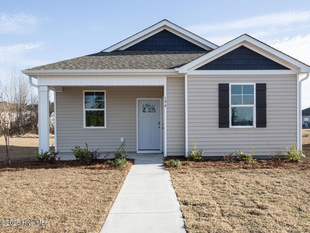 194 N Atlantic Ave Lot 128, Wilmington, NC 28411 - bungalow-style home with covered porch and roof with shingles