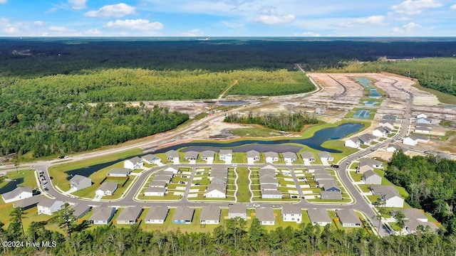 birds eye view of property with a view of trees