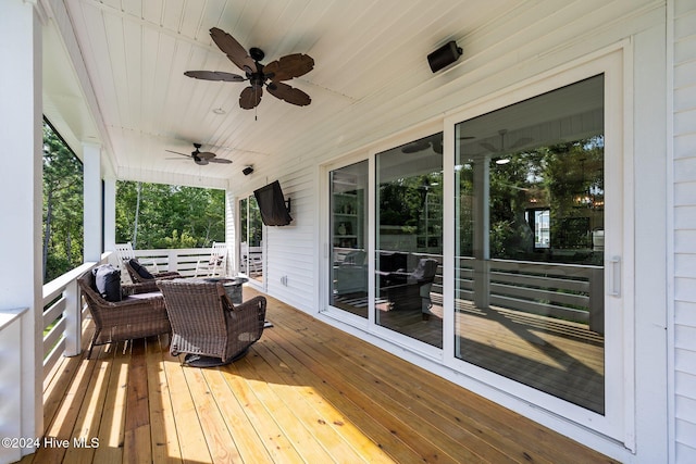 deck featuring ceiling fan and a porch