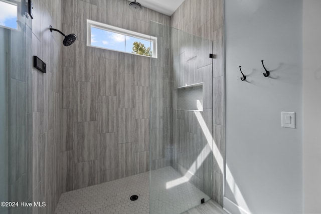 bathroom with a tile shower