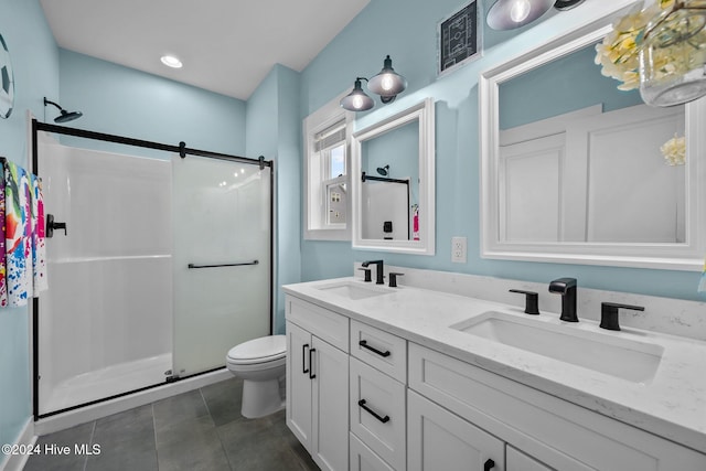 bathroom featuring vanity, toilet, and walk in shower