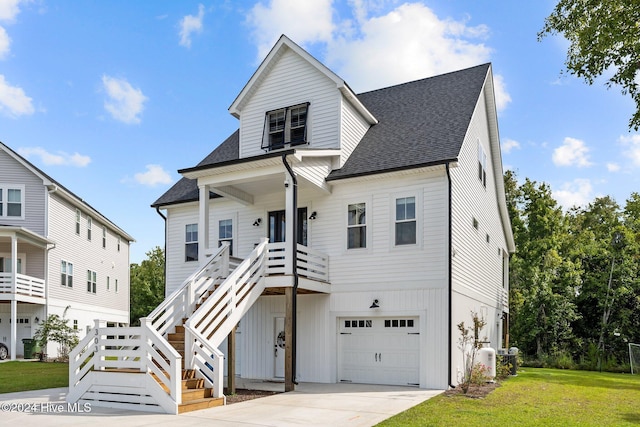 view of front of house featuring a garage and a front yard