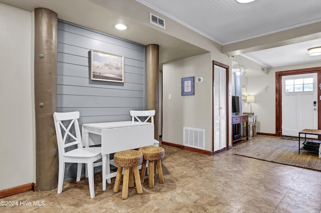 dining area with crown molding