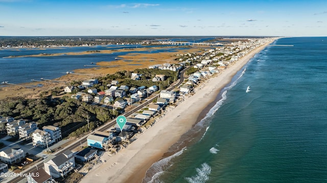 aerial view featuring a view of the beach and a water view