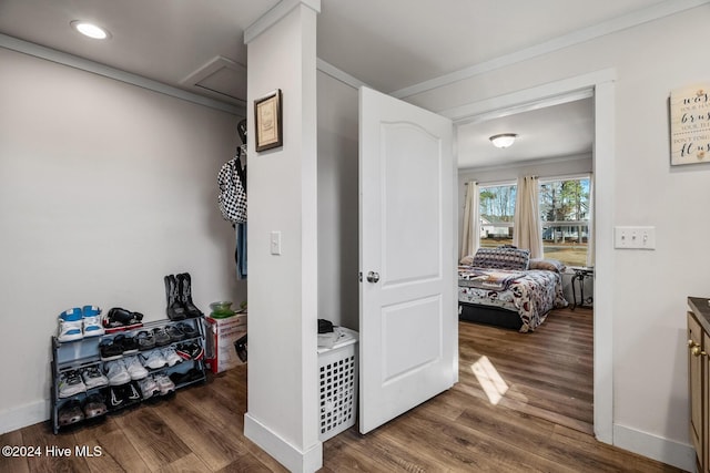 hall featuring crown molding and dark hardwood / wood-style flooring