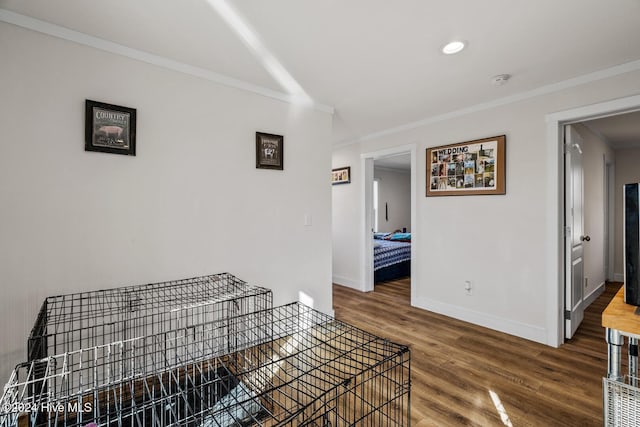 hall with dark hardwood / wood-style floors and crown molding