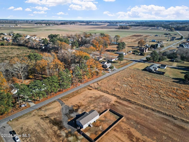 birds eye view of property with a rural view