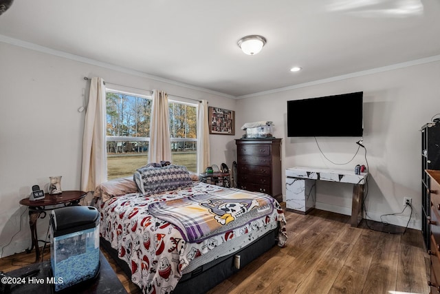 bedroom featuring hardwood / wood-style floors and ornamental molding