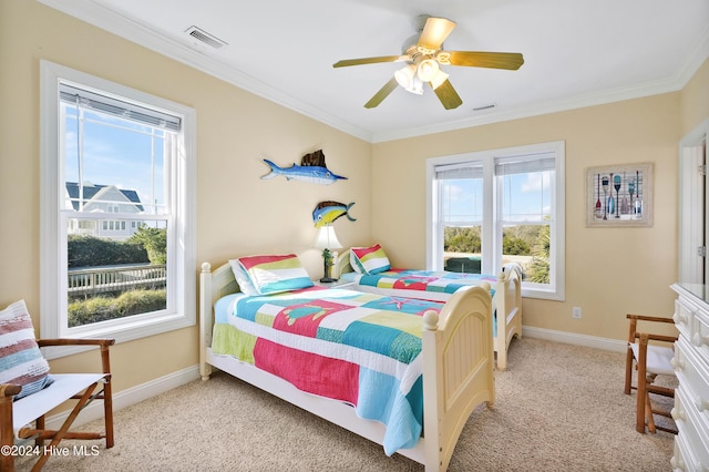 bedroom with light carpet, ornamental molding, and ceiling fan