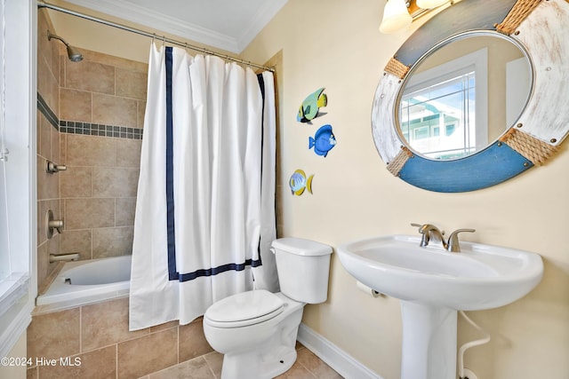 bathroom with tile patterned flooring, ornamental molding, shower / tub combo, and toilet