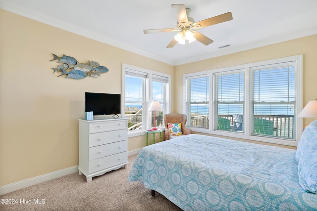 bedroom with crown molding, light carpet, and ceiling fan