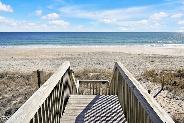 property view of water featuring a beach view