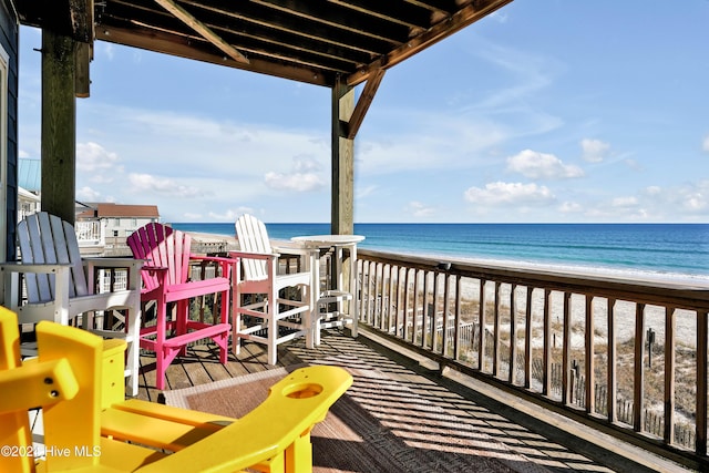 exterior space featuring a view of the beach and a water view