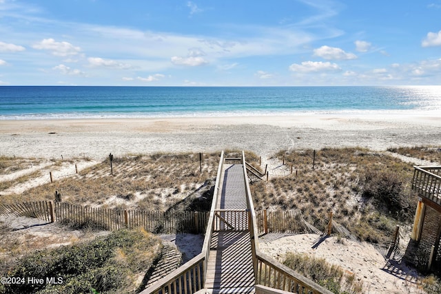 property view of water featuring a beach view