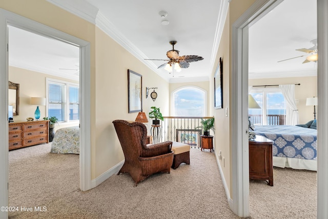 interior space featuring crown molding, ceiling fan, light carpet, and access to outside