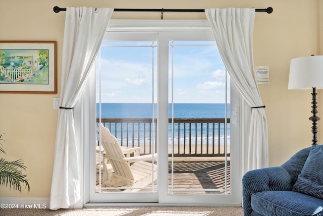 interior space featuring a water view and a view of the beach