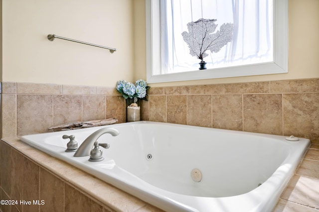 bathroom featuring a relaxing tiled tub