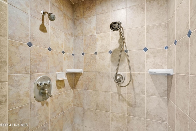 bathroom with tiled shower