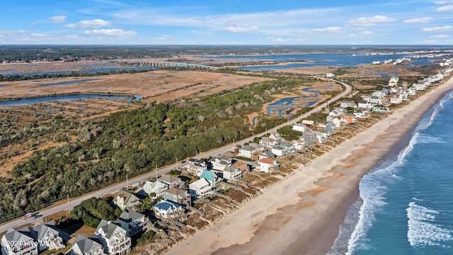 drone / aerial view with a view of the beach and a water view