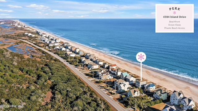 drone / aerial view featuring a view of the beach and a water view