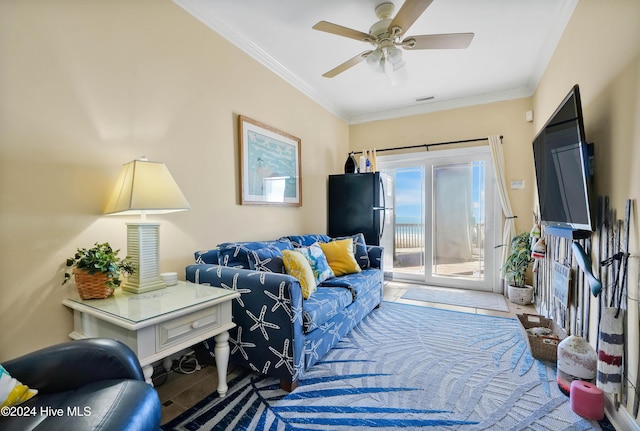 living room with crown molding and ceiling fan