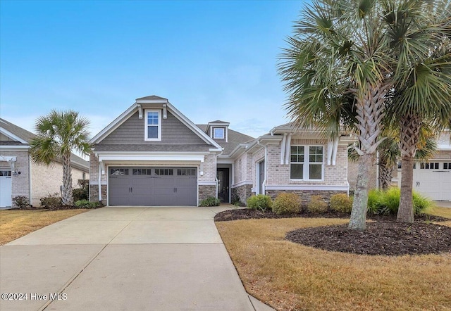 view of front of home with a garage and a front yard