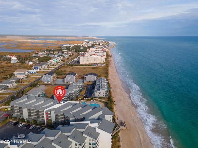 drone / aerial view featuring a view of the beach and a water view