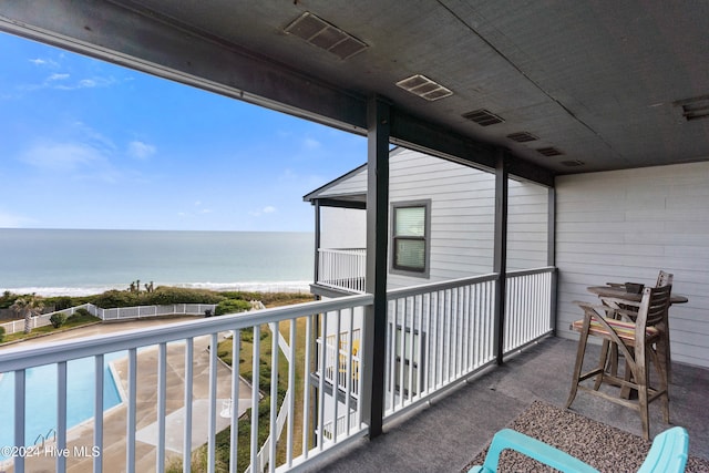 balcony with a view of the beach and a water view