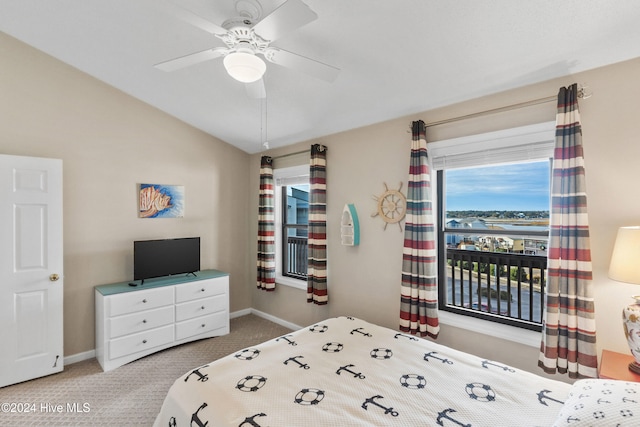 bedroom featuring ceiling fan, vaulted ceiling, and carpet