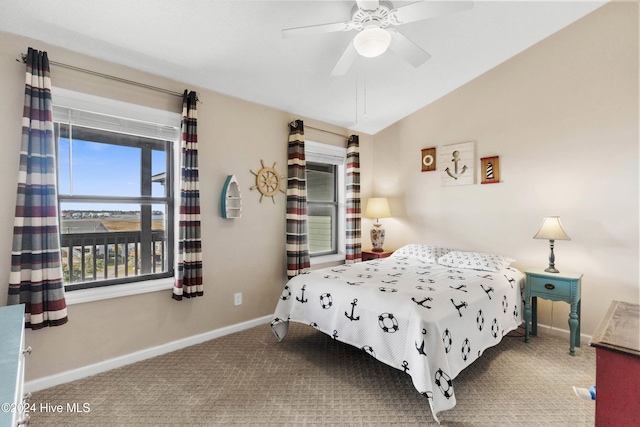 bedroom with carpet floors, vaulted ceiling, and ceiling fan