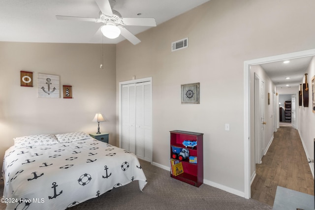 bedroom featuring vaulted ceiling, ceiling fan, and a closet