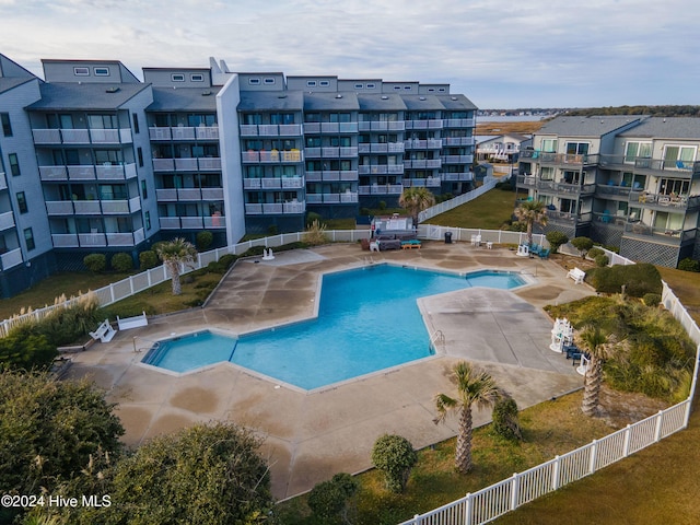 view of swimming pool with a patio area