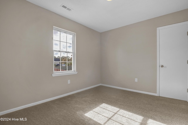 spare room featuring carpet flooring