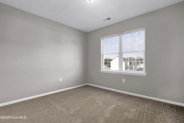 unfurnished room featuring carpet flooring