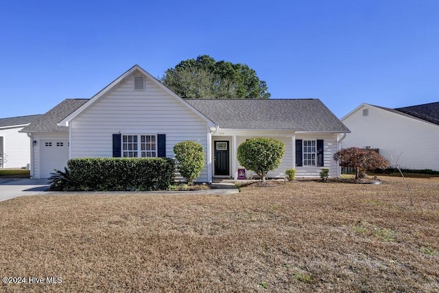 ranch-style house with a front yard and a garage