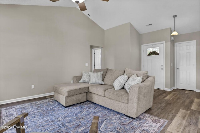 living room with hardwood / wood-style floors, ceiling fan, and lofted ceiling