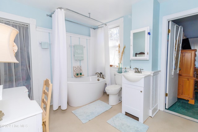 bathroom with a bathing tub, vanity, toilet, and concrete floors