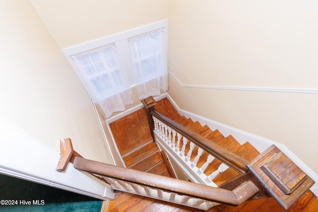 stairway with wood-type flooring