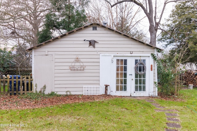 view of outbuilding with a lawn