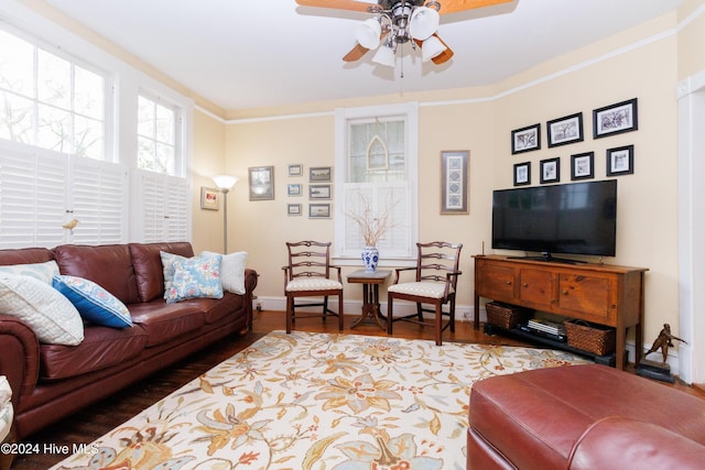 living room with crown molding, ceiling fan, and hardwood / wood-style flooring