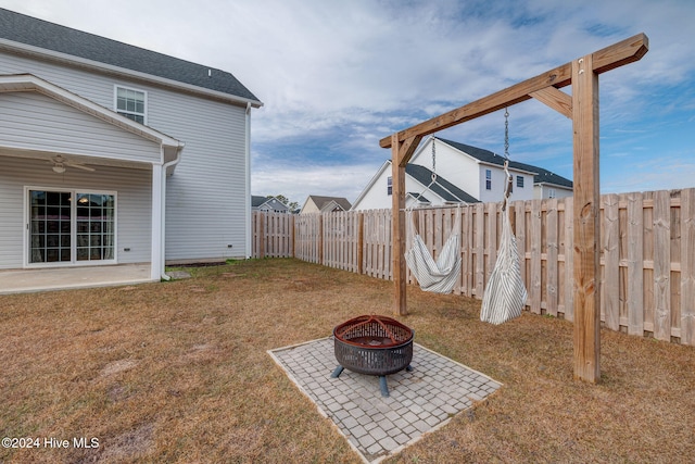 view of yard with a patio area and a fire pit