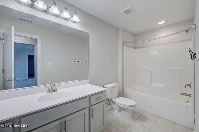 full bathroom with tile patterned floors, shower / bathing tub combination, vanity, and toilet