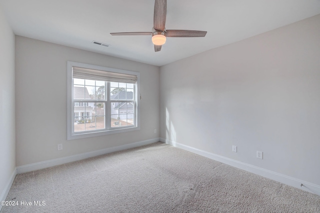 unfurnished room featuring carpet and ceiling fan